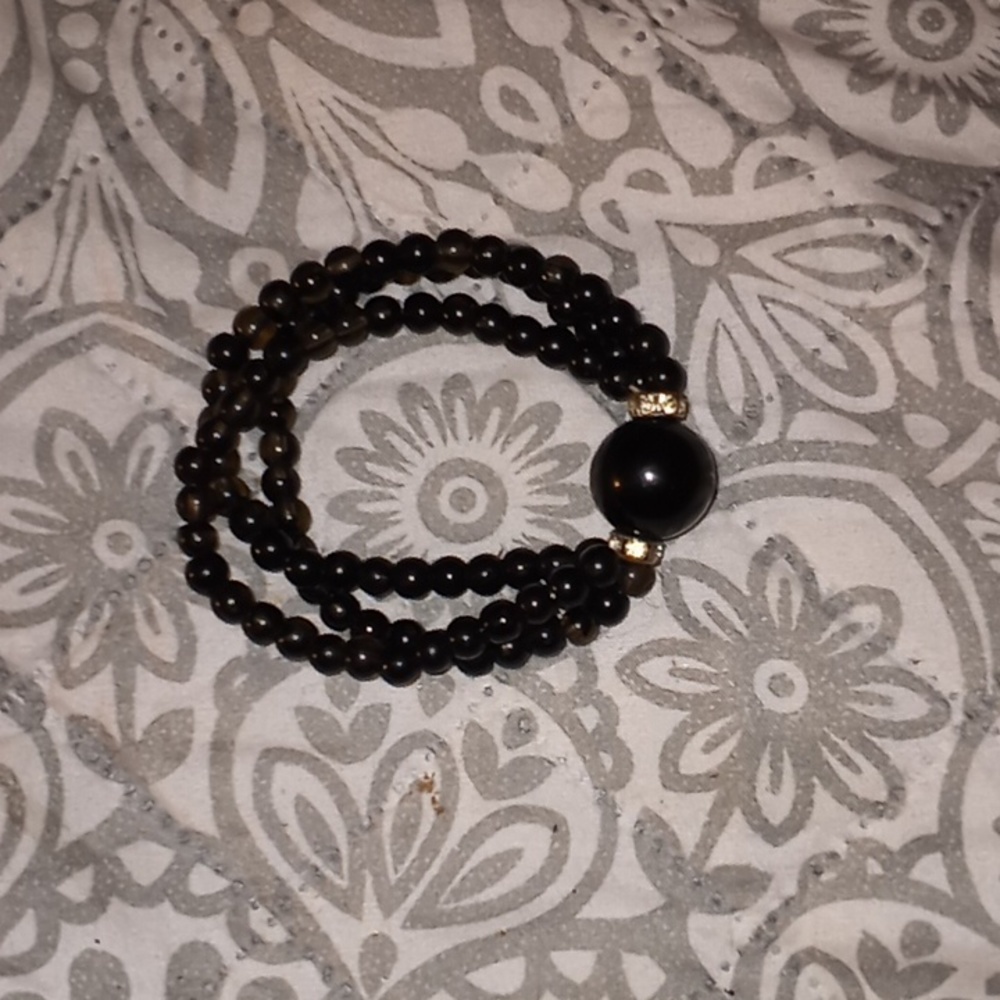 Womens black bracelet with yellow rhinestones